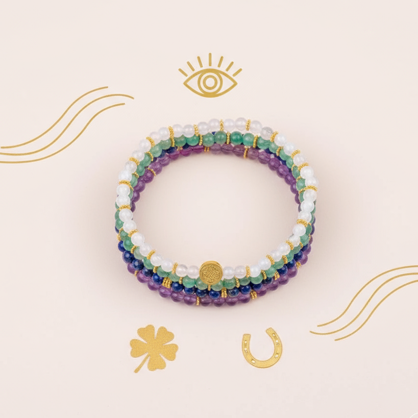 Multicolored gemstone luck bracelets displayed in a circle on soft cream surface with gold symbolic illustrations. — for Carpe Diem Dream