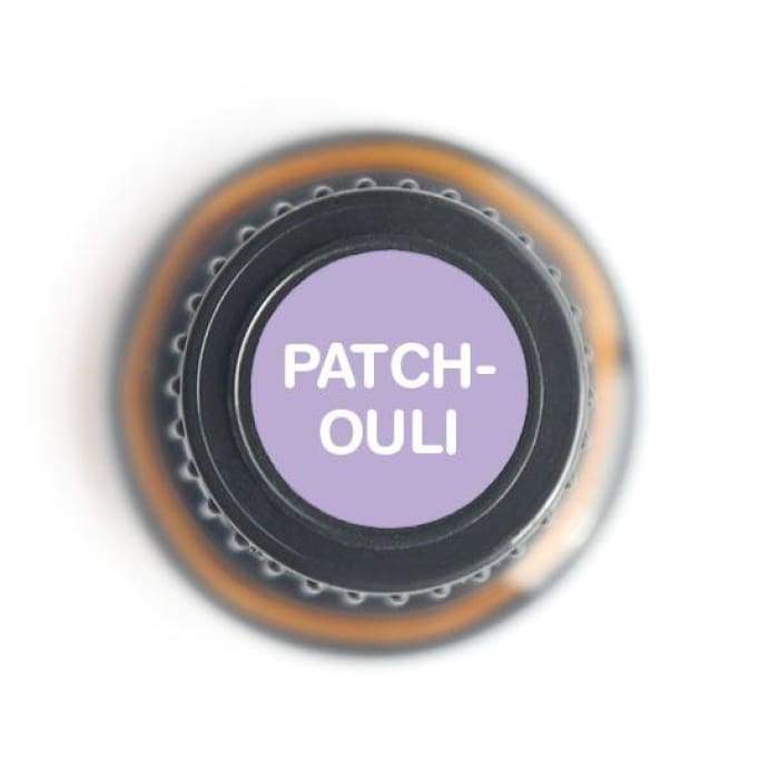 Top view of amber glass bottle cap labeled Patchouli on white background. — for Carpe Diem Dream