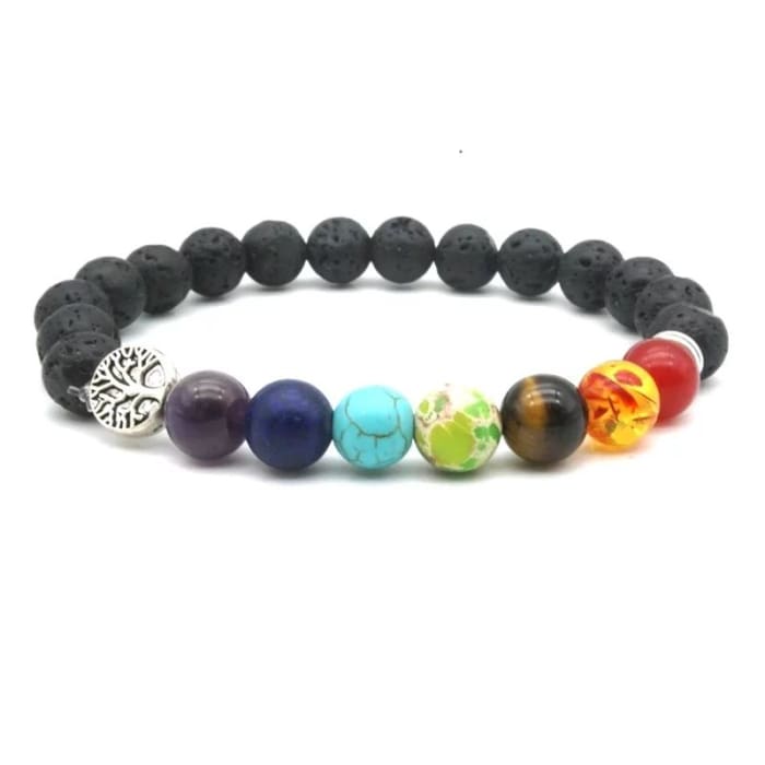 A black lava stone stretch bracelet with multicolored chakra beads and a silver Tree of Life charm displayed on a white background. — for Carpe Diem Dream