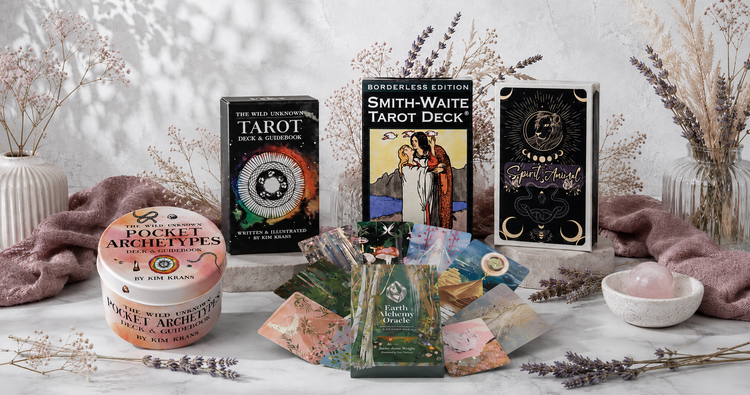 Tarot & Oracle Cards collection featuring Smith-Waite Tarot, The Wild Unknown Tarot, Pocket Archetypes, Spirit Animal, and Earth Alchemy Oracle decks in a bright botanical studio. — for Carpe Diem Dream