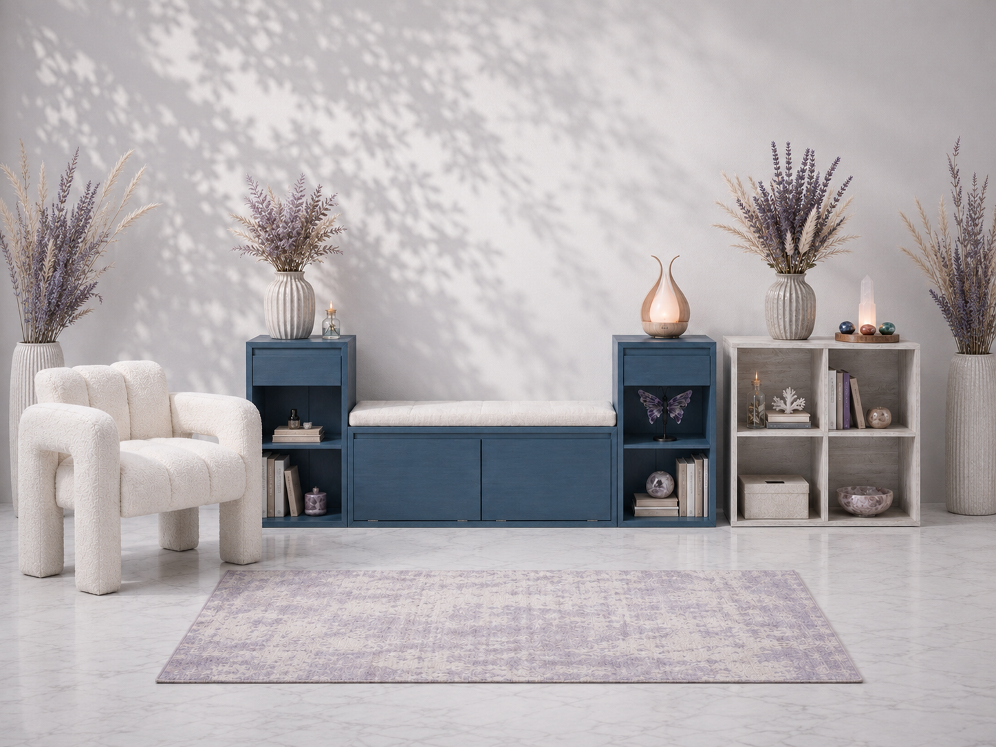 Foundational Furnishings collection featuring a navy storage bench, whitewashed cube organizer, bouclé accent chair, crystal lighting, candles, and botanical styling in a cool-toned studio setting — for Carpe Diem Dream