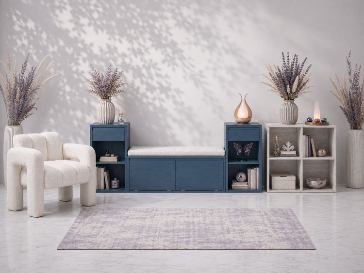Foundational Furnishings collection featuring a navy storage bench, whitewashed cube organizer, bouclé accent chair, crystal lighting, candles, and botanical styling in a cool-toned studio setting — for Carpe Diem Dream