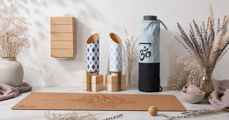 Meditation & Yoga Essentials collection featuring a yoga mat, yoga bag, yoga storage tubes, wall-mounted block holder, and cork massage ball in a bright botanical studio. — for Carpe Diem Dream