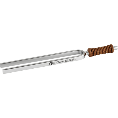 Single metal tuning fork with cork handle engraved Chiron 172.86 Hz shown on a white background. — for Carpe Diem Dream