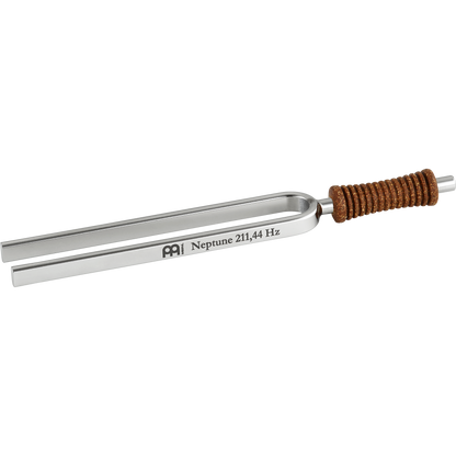 Single metal tuning fork with cork handle engraved Neptune 211.44 Hz shown on a white background. — for Carpe Diem Dream
