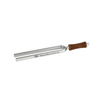 Single metal tuning fork with cork handle engraved Sidereal Moon 227.43 Hz shown on a white background. — for Carpe Diem Dream