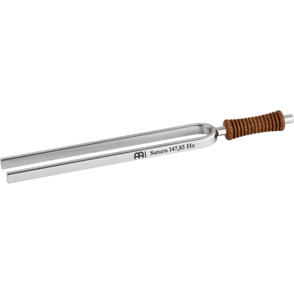 Single metal tuning fork with cork handle engraved Saturn 147.85 Hz shown on a transparent background. — for Carpe Diem Dream