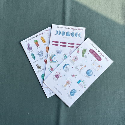 Three 4x6 inch Magic Moon planner sticker sheets featuring moon phases, crystals, and celestial illustrations arranged on a muted green textured background — for Carpe Diem Dream