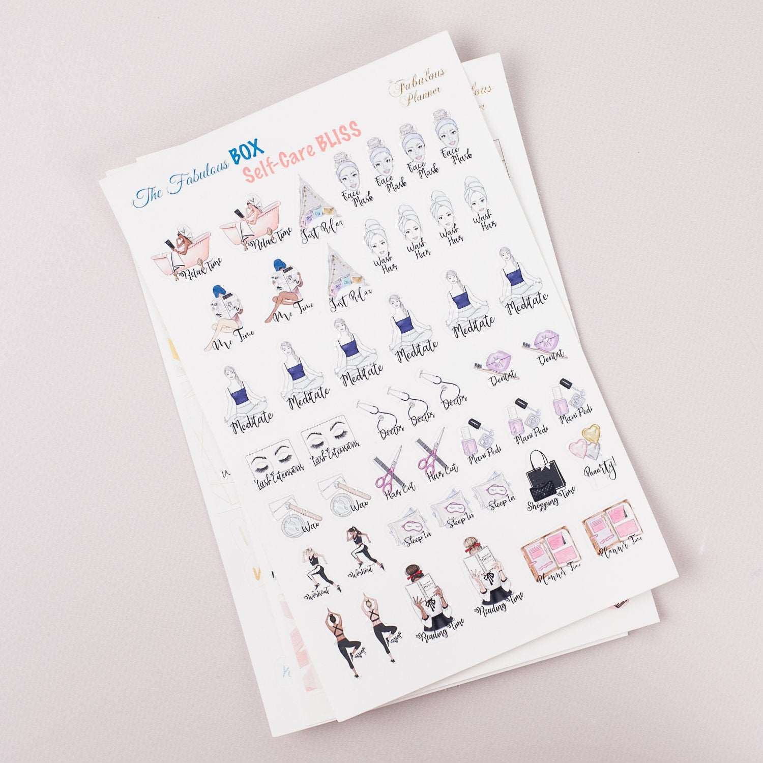 Angled view of three 4x6 inch self care planner sticker sheets stacked together displaying illustrated wellness icons and motivational text on a light background. — for Carpe Diem Dream