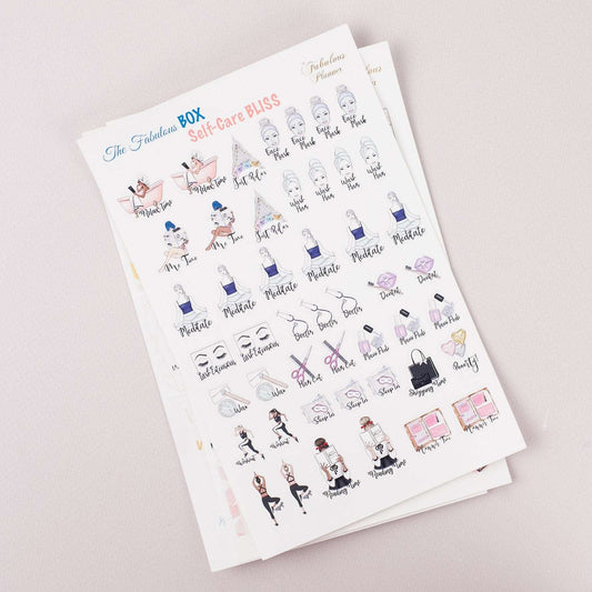 Angled view of three 4x6 inch self care planner sticker sheets stacked together displaying illustrated wellness icons and motivational text on a light background. — for Carpe Diem Dream