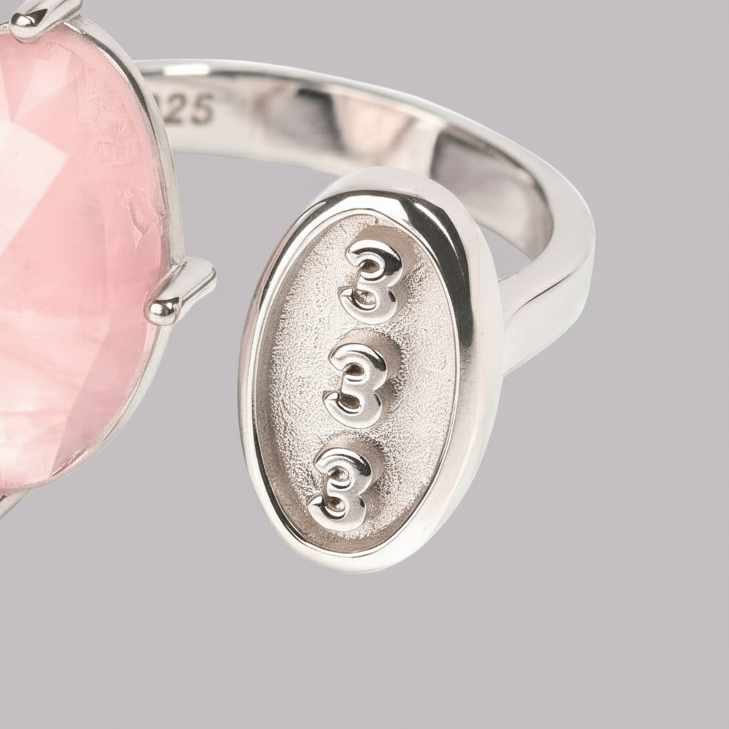 Close-up of the silver 333 engraving and rose quartz stone on a soft studio backdrop. — for Carpe Diem Dream