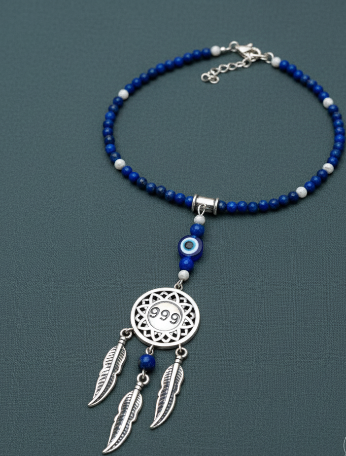 Silver dream catcher necklace with 999 angel number pendant and blue gemstone beaded chain displayed on soft sage background. — for Carpe Diem Dream
