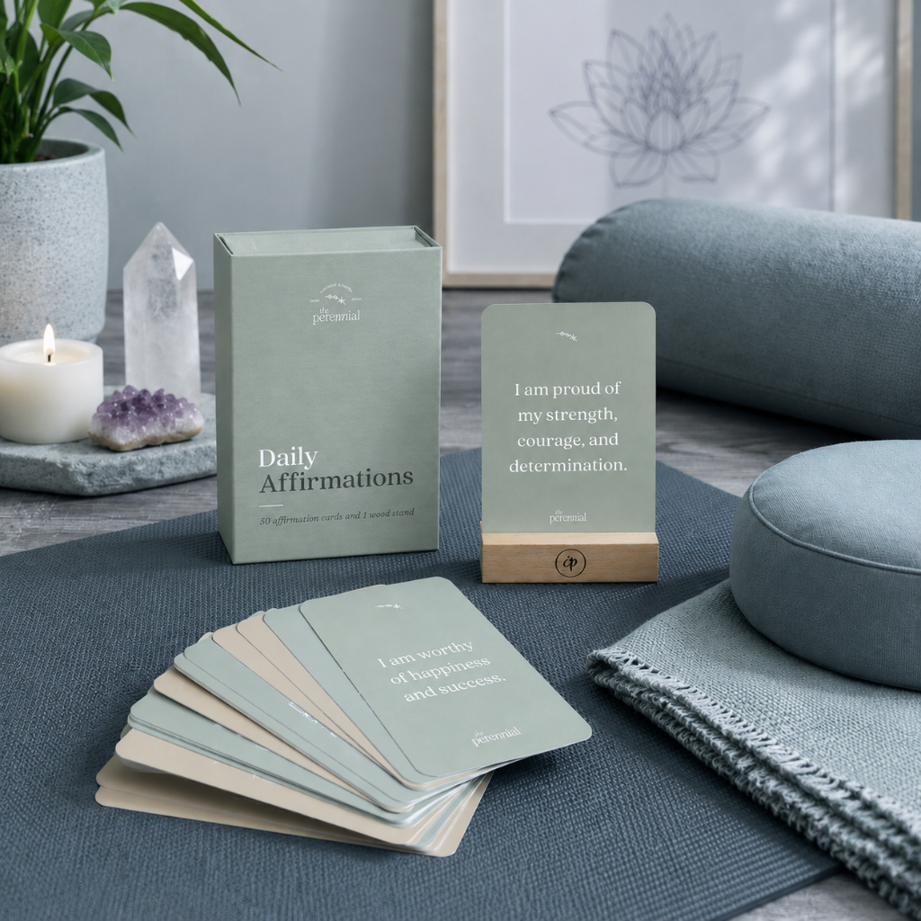 Daily affirmation cards with wooden stand in a cool-toned meditation and yoga space with cushions, crystal, and candle — for Carpe Diem Dream.