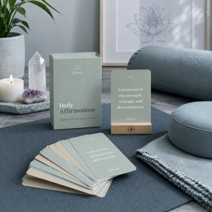 Daily affirmation cards with wooden stand in a cool-toned meditation and yoga space with cushions, crystal, and candle — for Carpe Diem Dream.