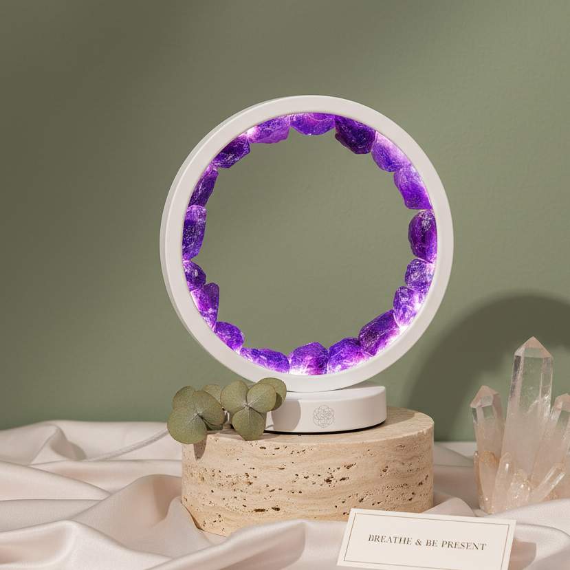 Amethyst halo lamp filled with natural crystals displayed upright on travertine pedestal with crystal points and soft backdrop. — for Carpe Diem Dream