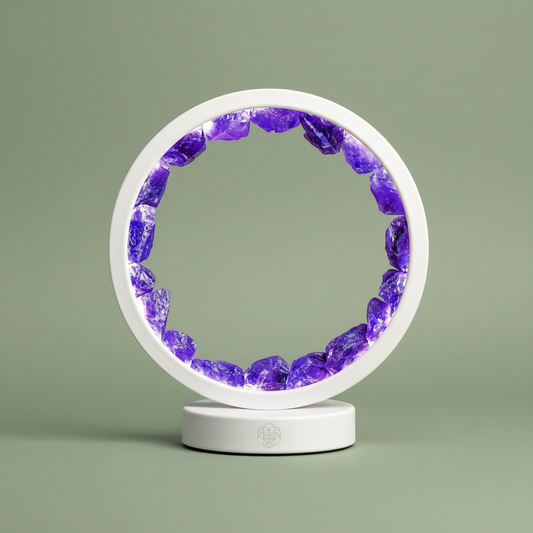 Round LED halo lamp filled with natural amethyst stones displayed upright against muted sage backdrop. — for Carpe Diem Dream