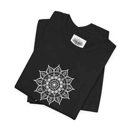 Aquarius Sun I Know zodiac T-shirt in black heather with white sun-inspired mandala artwork, shown folded with Carpe Diem Dream neck label in a supplier mockup. — for Carpe Diem Dream