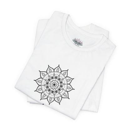 Aries Sun I Am zodiac T-shirt in white with black mandala artwork, shown folded with Carpe Diem Dream neck label in a supplier mockup. — for Carpe Diem Dream
