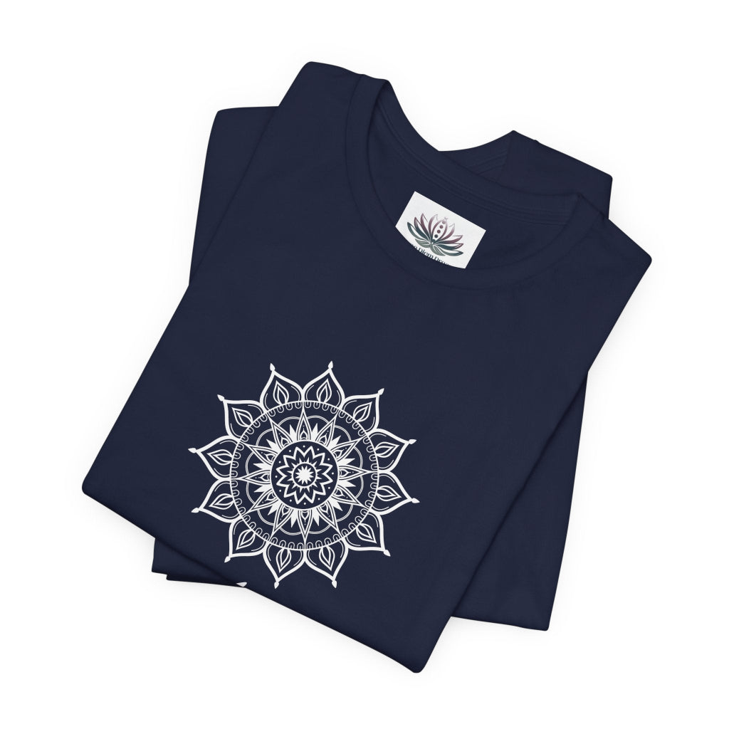 Aries Sun I Am zodiac T-shirt in navy with white sun-inspired mandala artwork, shown folded with Carpe Diem Dream neck label in a supplier mockup. — for Carpe Diem Dream