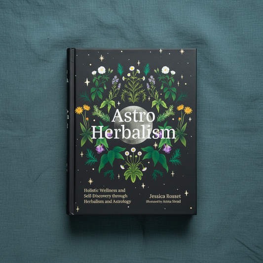 Astro Herbalism by Jessica Rosset displayed upright on a textured teal linen background highlighting the botanical cover artwork. — for Carpe Diem Dream