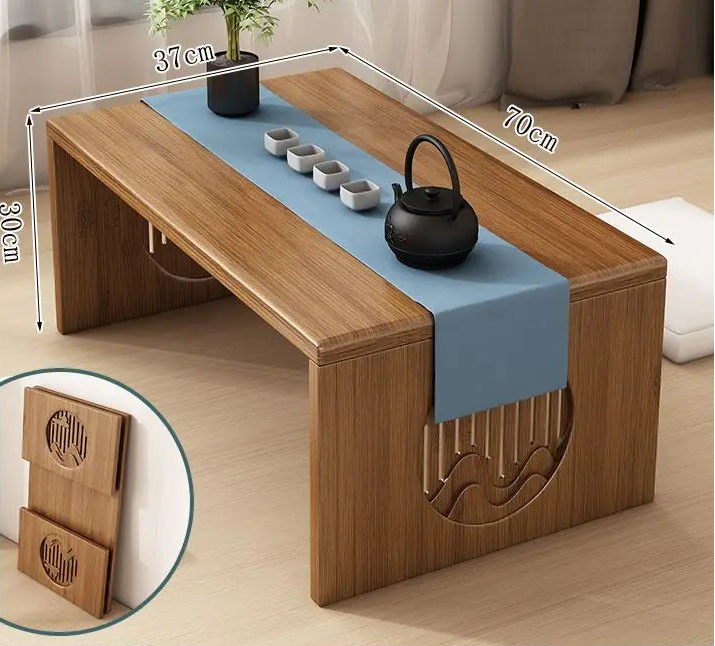 A bamboo folding table in a 70cm size displayed in a minimalist interior setting with a tea setup on top. — for Carpe Diem Dream