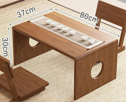 bamboo folding table in 80cm size displayed in a natural interior setting with a tea setup, showing its mid-size surface and low-profile design. — for Carpe Diem Dream