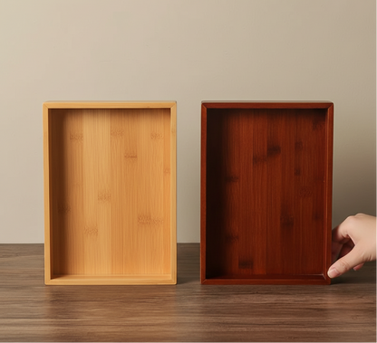 Two rectangular bamboo trays displayed side by side in light and dark wood finishes on a wooden surface. — for Carpe Diem Dream