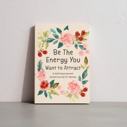 Be The Energy You Want to Attract guided journal displayed upright against a textured plaster wall with soft natural light, highlighting the floral cover and self-discovery theme — for Carpe Diem Dream