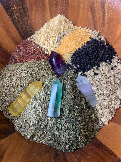 Organic ingredients for Be Well Immuni-Tea arranged with Fluorite crystal points, featuring mullein leaf, nettle leaf, yarrow, peppermint, rose hips, elderberries, orange zest, and ginger. — for Carpe Diem Dream