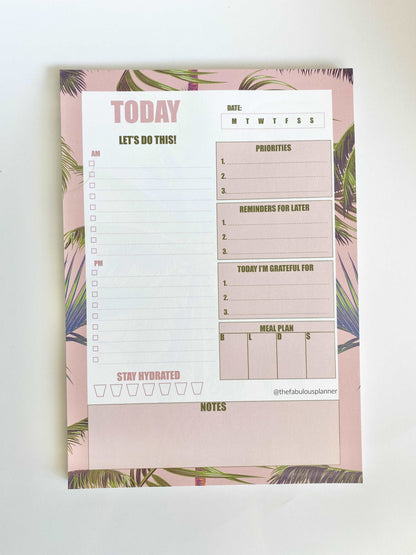 Pink tropical leaves 7x10 daily planner notepad shown upright on a clean white background — for Carpe Diem Dream