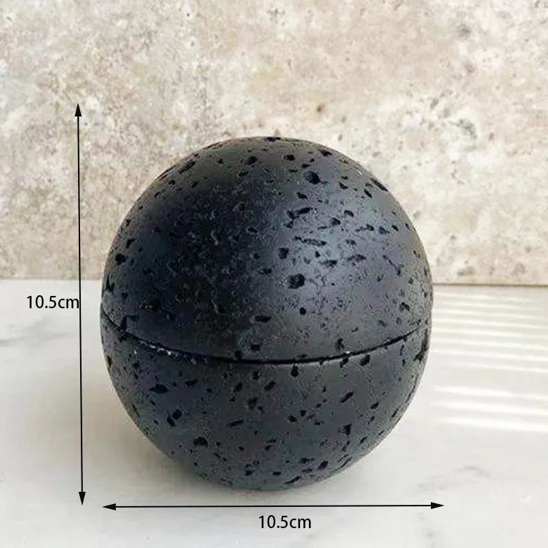 A black travertine sphere incense burner displayed with size dimensions on a white background showing natural stone variation. — for Carpe Diem Dream