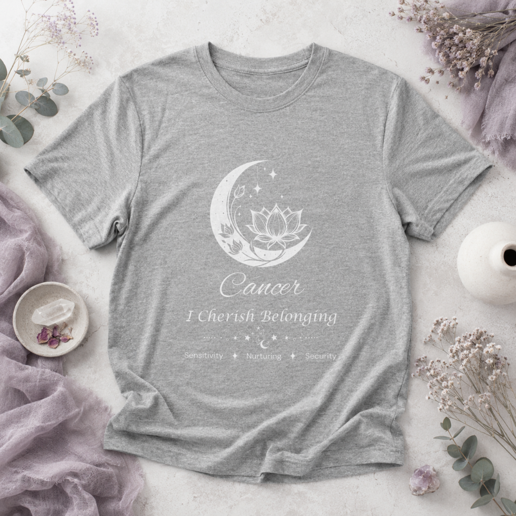 Cancer Moon I Cherish Belonging zodiac T-shirt in Athletic Heather with white moon-inspired lotus, floral, and celestial artwork and Sensitivity, Nurturing, Security text, styled in a cool-toned studio botanical flat lay. — for Carpe Diem Dream