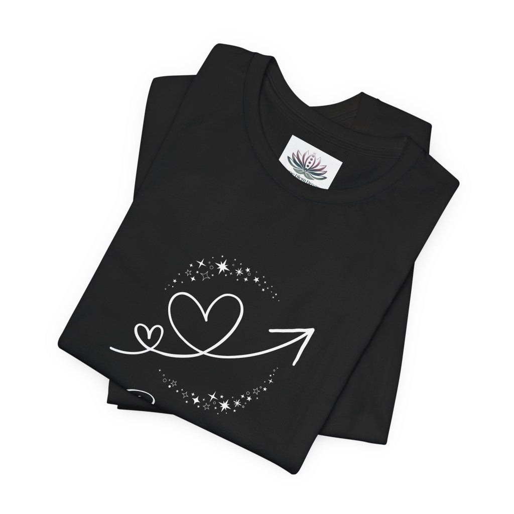 Cancer Rising I Protect zodiac T-shirt in black with white celestial heart and arrow artwork, shown folded in a supplier mockup. — for Carpe Diem Dream