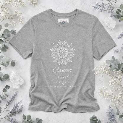 Cancer Sun I Feel zodiac T-shirt in athletic heather with white sun-inspired mandala artwork and Intuition, Compassion, Devotion text, styled in a cool-toned studio botanical flat lay. — for Carpe Diem Dream