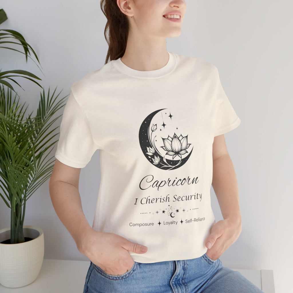Model wearing a Natural Capricorn Moon I Cherish Security zodiac T-shirt with black moon-inspired lotus, floral, and celestial artwork. — for Carpe Diem Dream