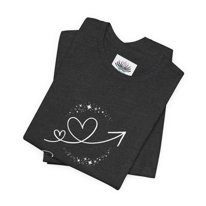 Capricorn Rising I Build zodiac T-shirt in Dark Grey Heather with white celestial heart and arrow artwork, shown folded in a supplier mockup. — for Carpe Diem Dream