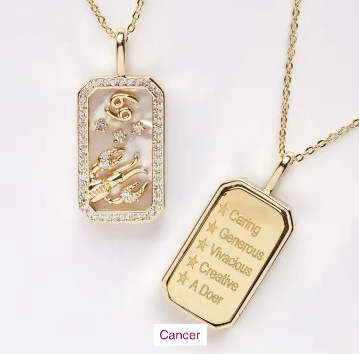 An 18K gold Cancer zodiac pendant necklace with constellation detailing and engraved Cancer traits displayed on a white background. — for Carpe Diem Dream