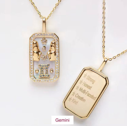An 18K gold Gemini zodiac pendant necklace with constellation detailing and engraved Gemini traits displayed on a white background. — for Carpe Diem Dream