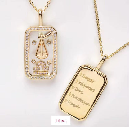 An 18K gold Libra zodiac pendant necklace with constellation detailing and engraved Libra traits displayed on a white background. — for Carpe Diem Dream