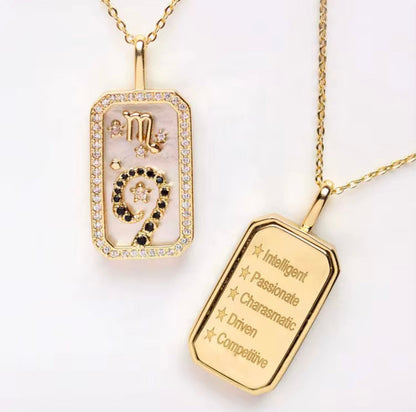 An 18K gold Scorpio zodiac pendant necklace with constellation detailing and engraved Scorpio traits displayed on a white background. — for Carpe Diem Dream