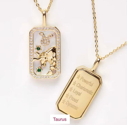 An 18K gold Taurus zodiac pendant necklace with constellation detailing and engraved Taurus traits displayed on a white background. — for Carpe Diem Dream