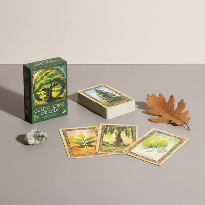 Celtic Tree Oracle deck displayed with cards laid out beside the box and natural elements, styled in a calm, minimalist home setting. — for Carpe Diem Dream