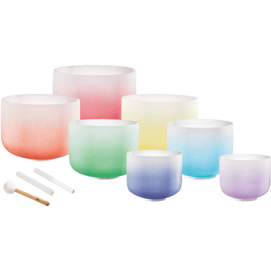 Seven gradient color frosted quartz crystal singing bowls in ascending sizes from 8 to 14 inches with silicone rods and mallet displayed on transparent background — for Carpe Diem Dream