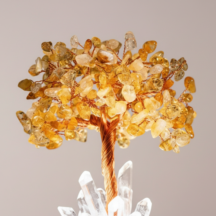 Golden citrine gemstone tree branches shown in close-up against smooth blush backdrop with clear quartz points beneath the trunk. — for Carpe Diem Dream