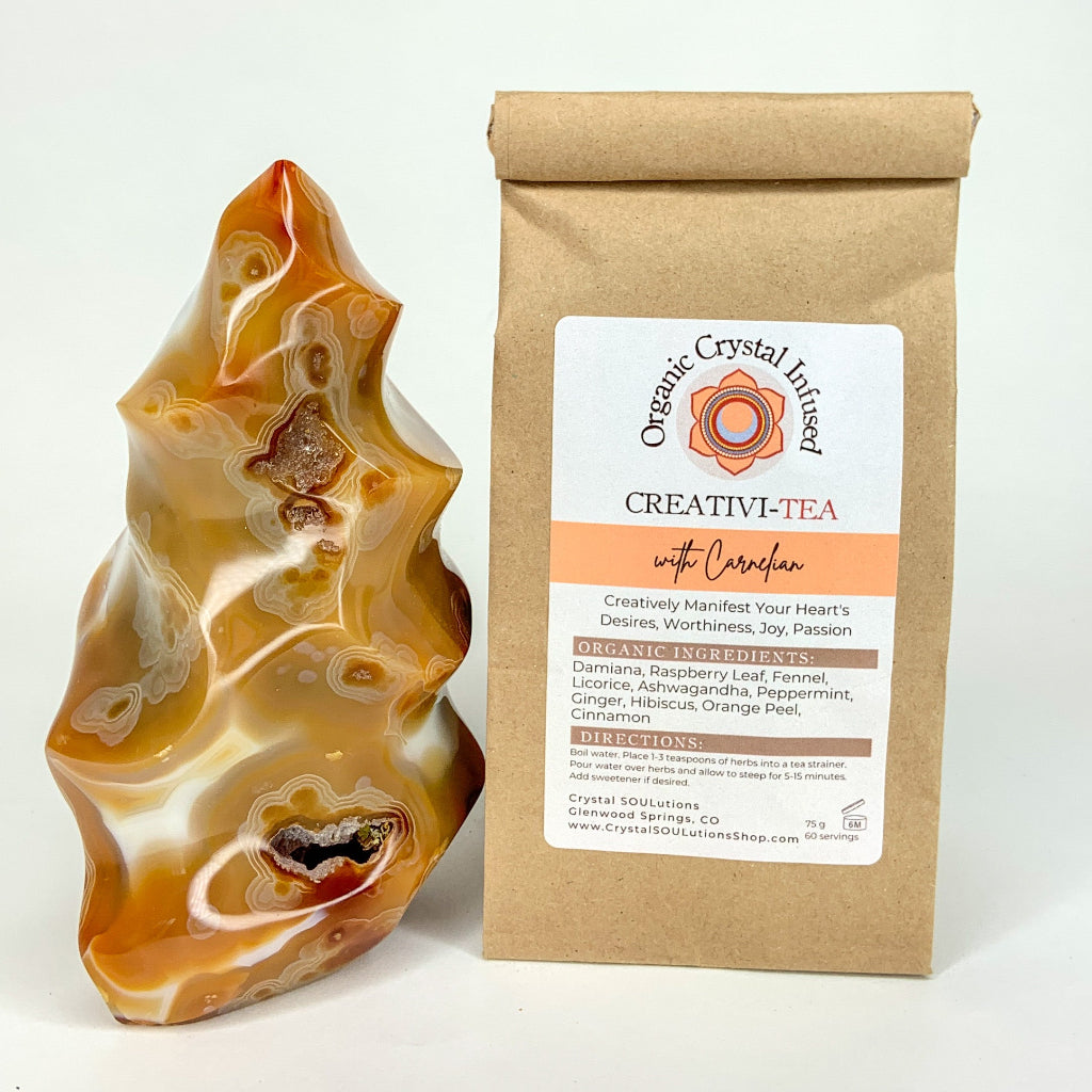 Creativi-Tea – Organic Crystal-Infused Herbal Tea with Carnelian in the authentic 75 g kraft bag supplier image, shown beside the original Carnelian crystal with the product packaging and label exactly as provided. — for Carpe Diem Dream