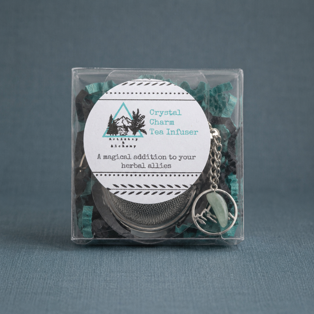 Crystal Charm Tea Infuser – authentic packaged tea infuser displayed on a dark teal textured linen backdrop with a matching linen surface, photographed in cool diffused daylight with soft natural shadows and premium commercial styling. The product remains the sole focal point with no props or additional objects. — for Carpe Diem Dream