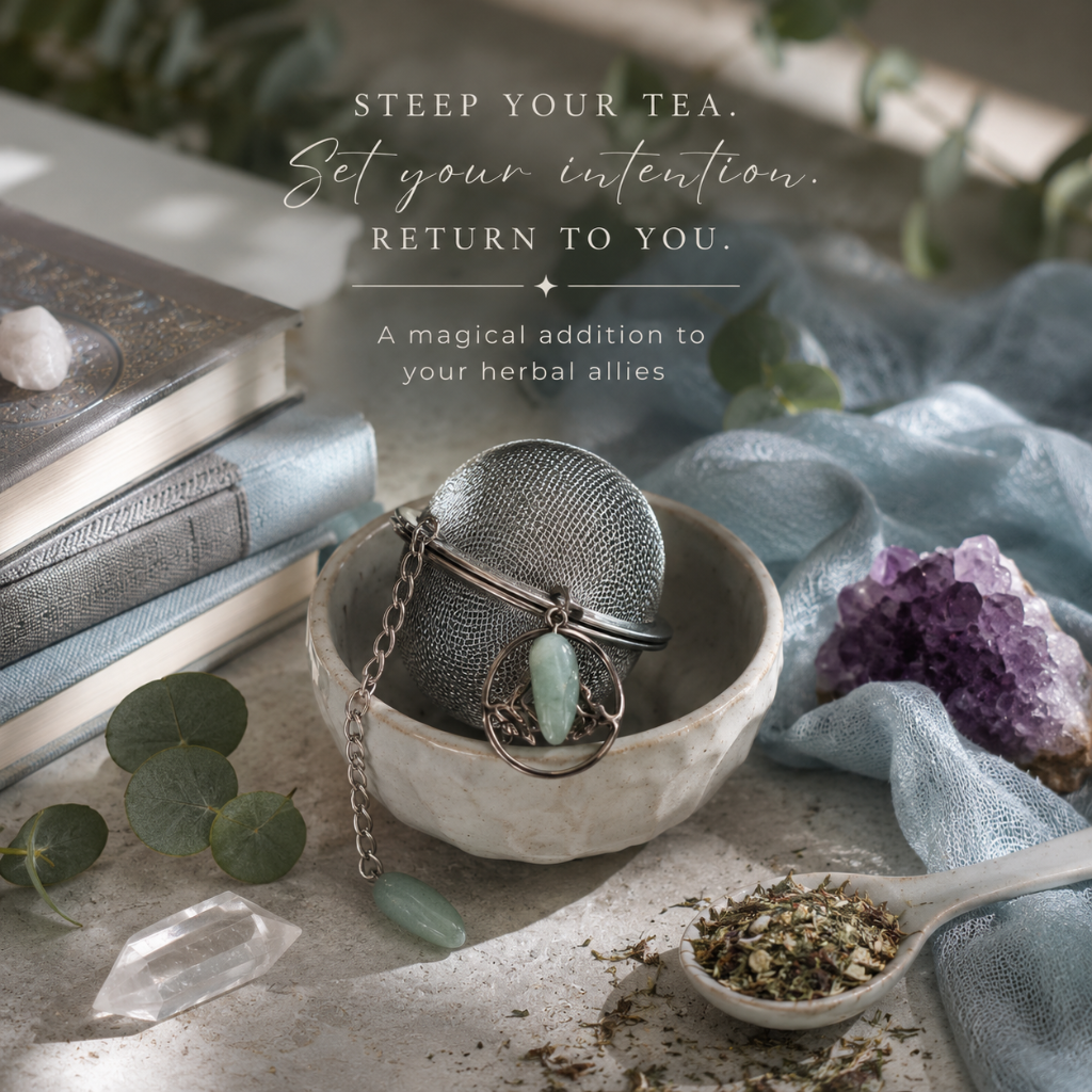 Crystal Charm Tea Infuser – authentic tea infuser styled in a creative signature story composition with loose herbal tea, natural stone, amethyst, clear quartz, eucalyptus, soft blue textiles, and cool diffused daylight. The product becomes part of an intentional tea ritual centered on presence, calm, and mindful living. — for Carpe Diem Dream