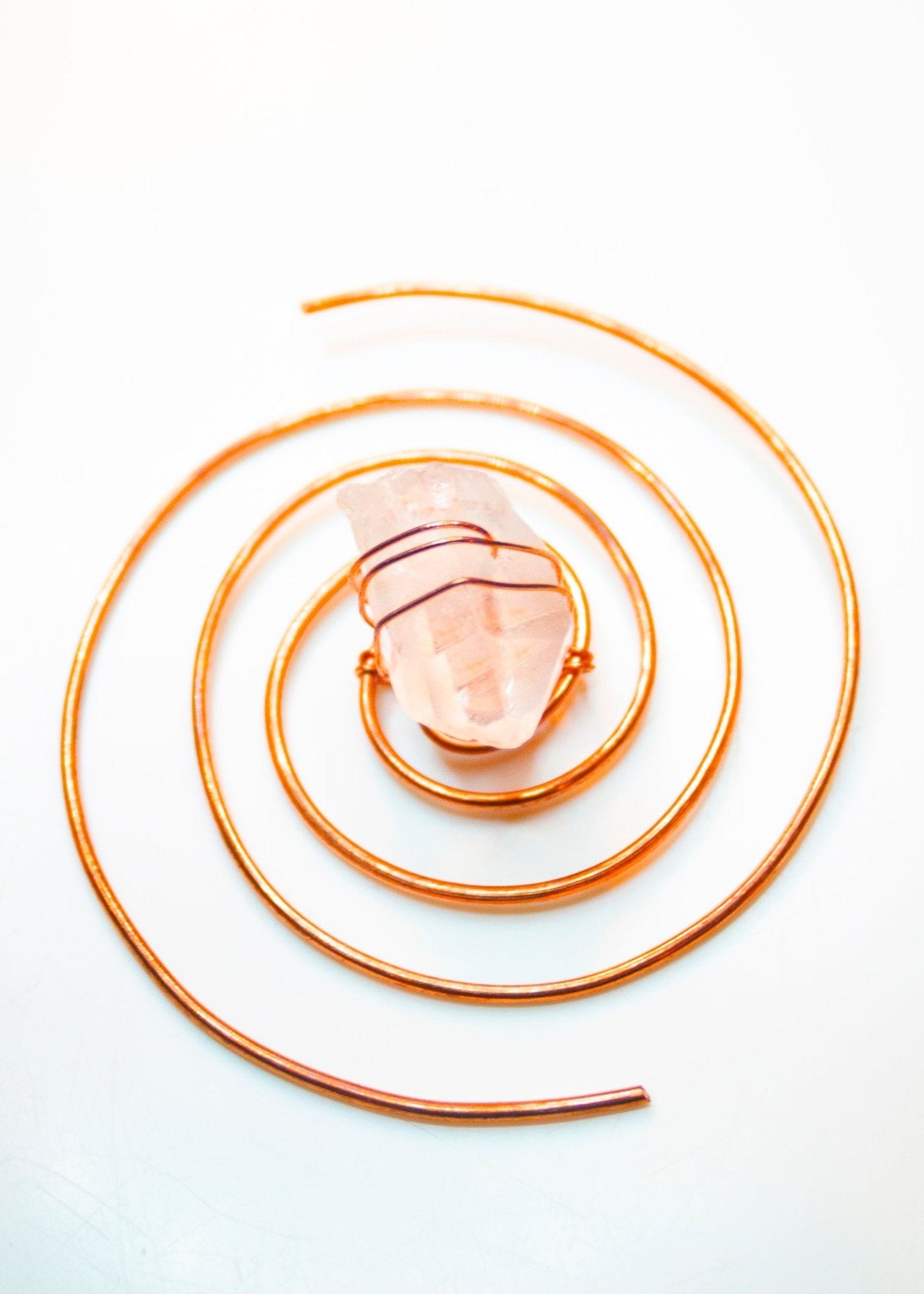 Clear quartz copper spiral crystal water charger displayed on a clean white background. — for Carpe Diem Dream