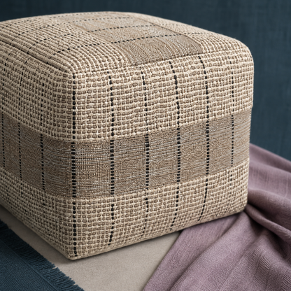 Close-up of the Elmer handwoven jute and cotton square pouf highlighting its natural and gray woven texture, stitched pattern, and craftsmanship. — for Carpe Diem Dream