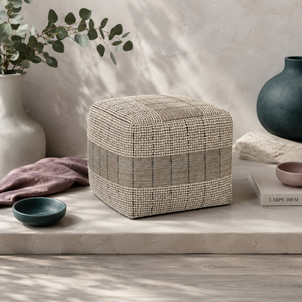 Elmer handwoven jute and cotton square pouf styled in the Carpe Diem Dream botanical studio with eucalyptus, mauve linen, dark teal ceramics, and cool natural light. — for Carpe Diem Dream